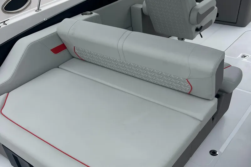 Slide: The Image of 2025 Hurricane FunDeck 2360 SFL OB boat seating with gray upholstery and red accents. - 11