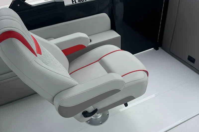 Slide: The Image of 2025 Hurricane FunDeck 2360 SFL OB boat seat with red accents on white upholstery. - 4