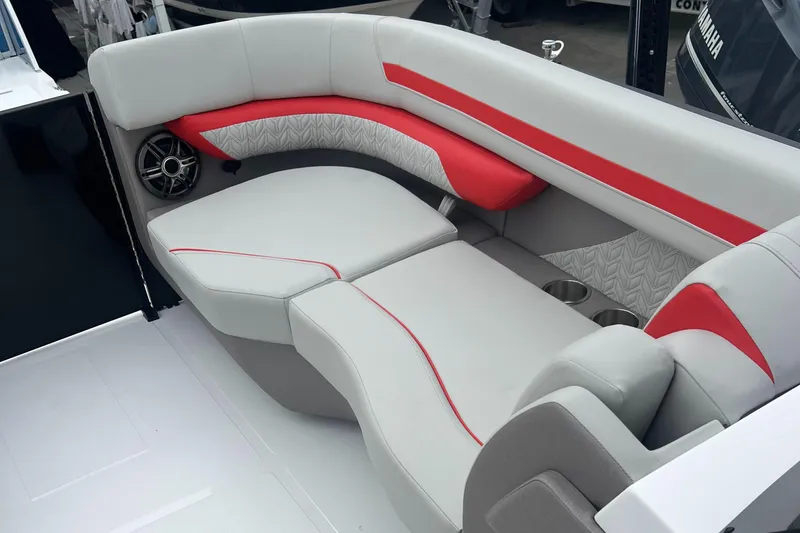 Slide: The Image of 2025 Hurricane FunDeck 2360 SFL OB boat interior with red and gray seating. - 8
