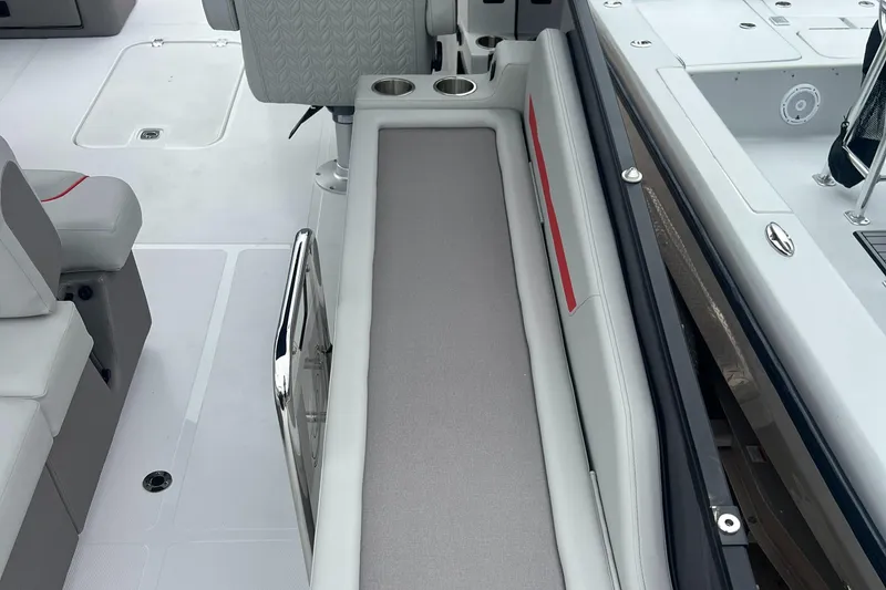 Slide: The Image of 2025 Hurricane FunDeck 2360 SFL OB interior with seating and cup holders. - 9