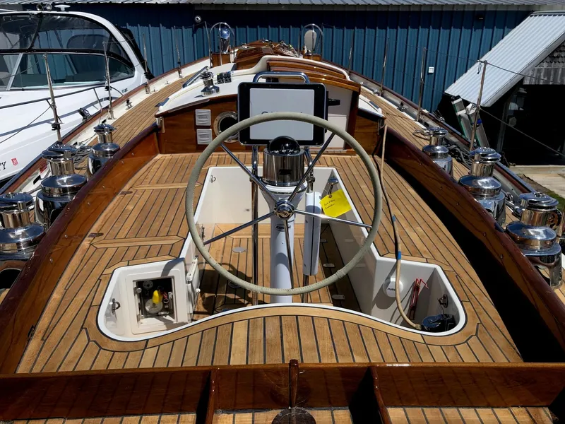 Slide: The Image of Cockpit of 2010 Sparkman & Stephens S&S 45 sailboat with wooden deck and steering wheel. - 33