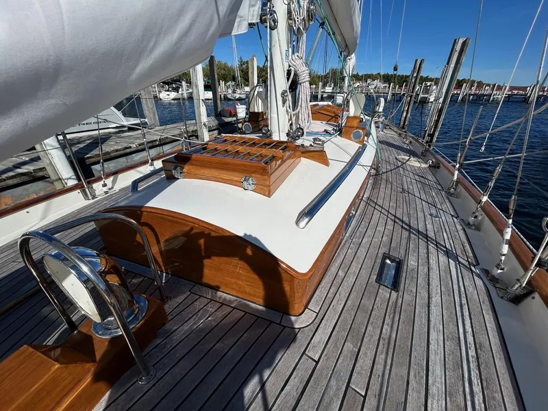 Slide: The Image of Sailing yacht deck of 2010 Sparkman & Stephens S&S 45, featuring wooden accents and marina view. - 34