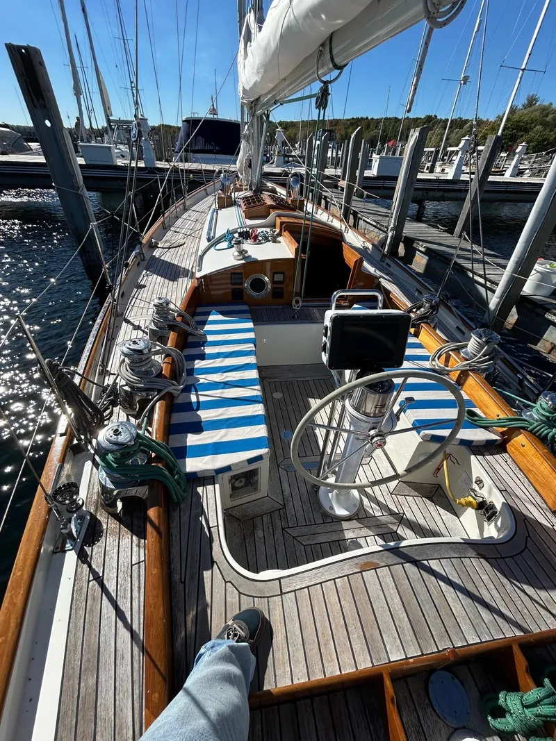 Slide: The Image of Sailboat deck of 2010 Sparkman & Stephens S&S 45, featuring striped seating and steering wheel. - 39
