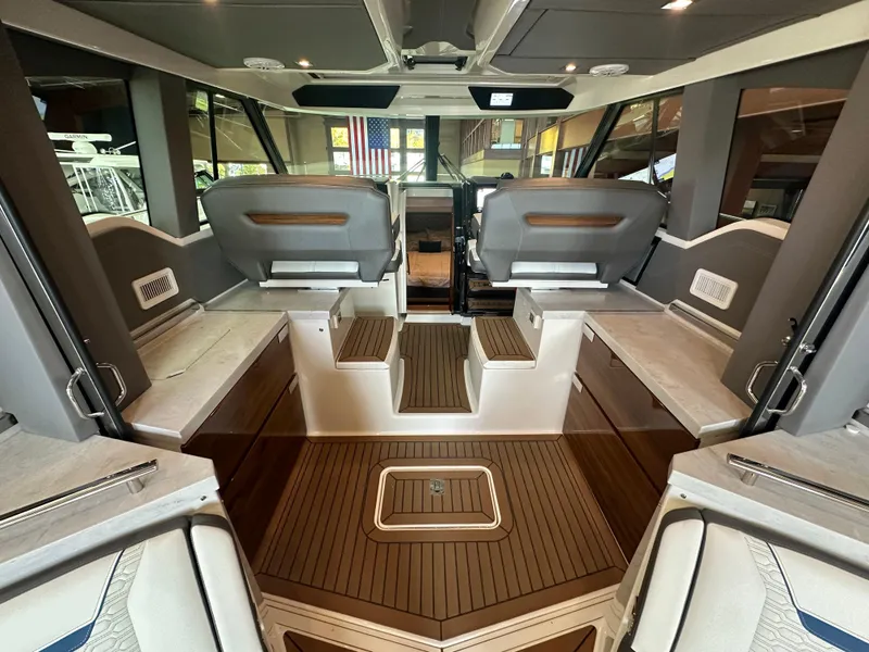 Slide: The Image of Luxurious interior of 2022 Tiara Yachts 43 LE with elegant seating and wood flooring. - 14