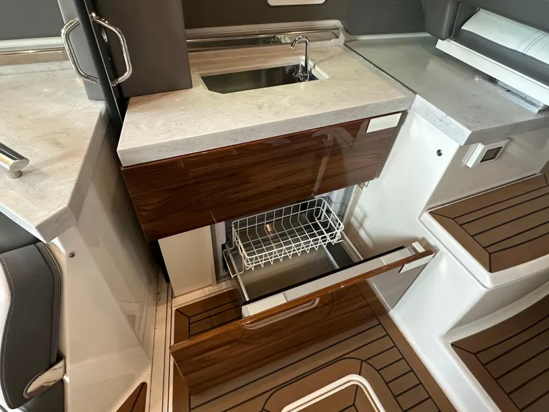 Slide: The Image of 2022 Tiara Yachts 43 LE interior with modern kitchen and dishwasher. - 17