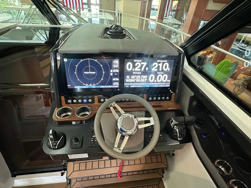 Slide: The Image of 2022 Tiara Yachts 43 LE helm with advanced navigation displays and controls. - 21