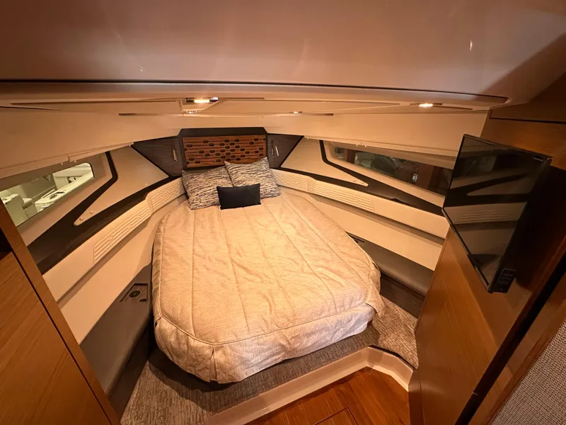 Slide: The Image of Luxurious cabin interior of 2022 Tiara Yachts 43 LE with cozy bedding. - 27