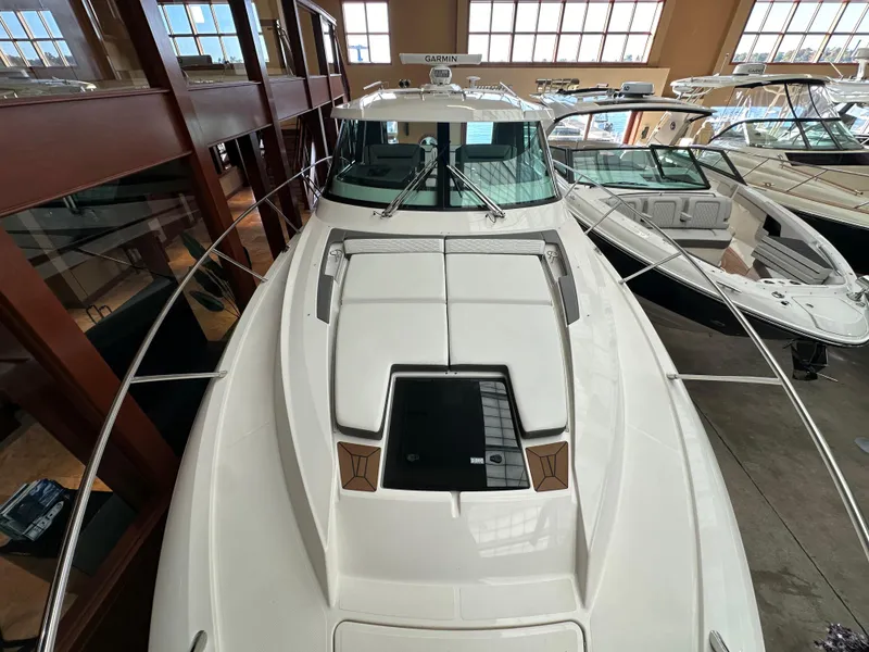 Slide: The Image of 2022 Tiara Yachts 43 LE boat displayed in showroom, top view. - 3