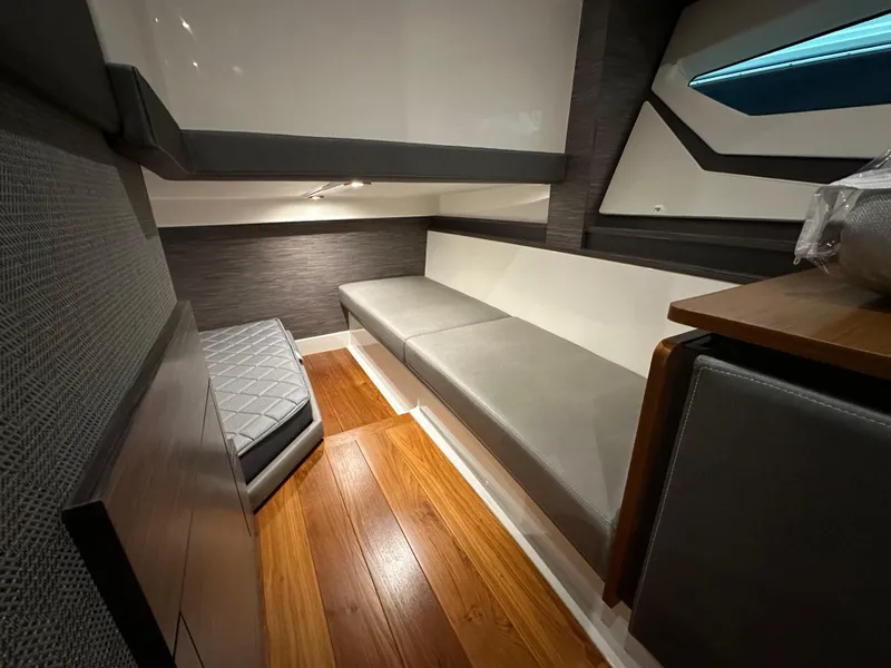 Slide: The Image of 2022 Tiara Yachts 43 LE interior with modern seating and wood flooring. - 31