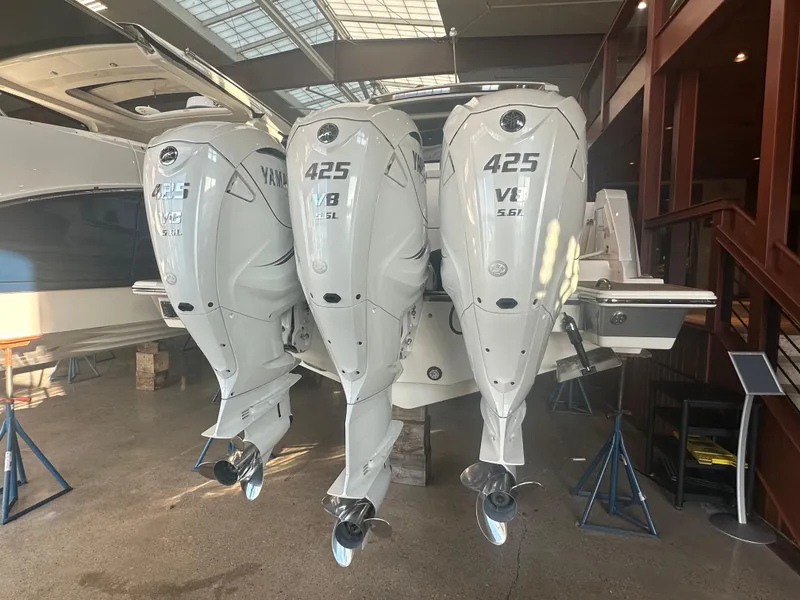 Slide: The Image of 2022 Tiara Yachts 43 LE with triple Yamaha 425 V8 engines in showroom. - 7