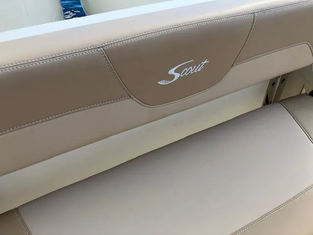 Slide: The Image of 2021 Scout 277 LXF boat seat with beige upholstery and logo. - 25