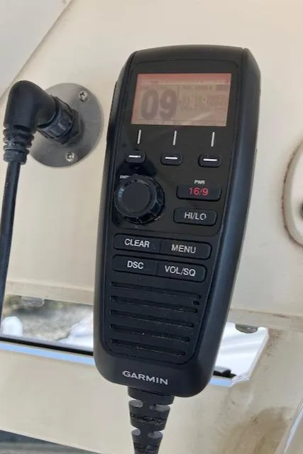 Slide: The Image of Garmin marine radio on 2021 Scout 277 LXF boat dashboard. - 33