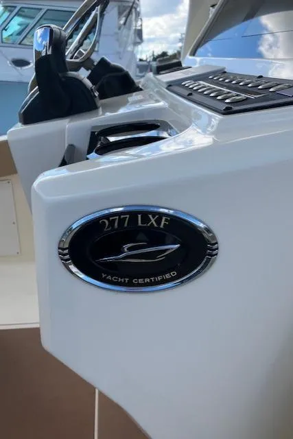 Slide: The Image of 2021 Scout 277 LXF yacht, sleek design, yacht certified badge. - 34
