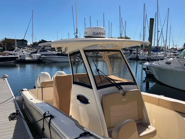 Slide: The Image of 2021 Scout 277 LXF boat docked in marina with Garmin equipment. - 4