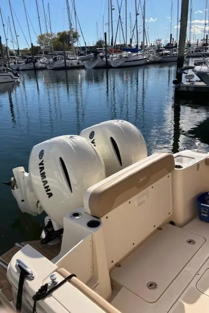 Slide: The Image of 2021 Scout 277 LXF boat with Yamaha engines docked at marina. - 41