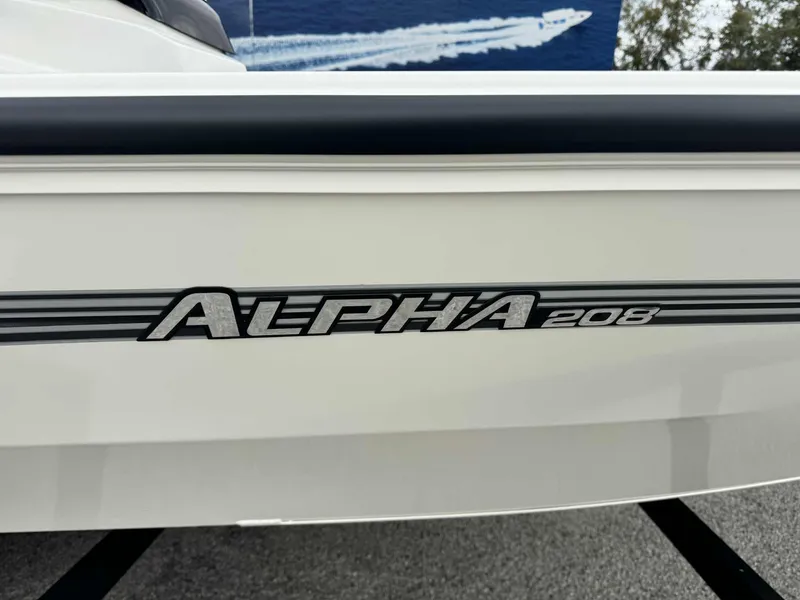 Slide: The Image of 2025 Ranger ALPHA 208 boat model nameplate on white hull. - 13