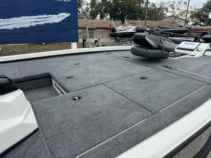 Slide: The Image of 2025 Ranger ALPHA 208 boat deck with seating and storage compartments. - 4