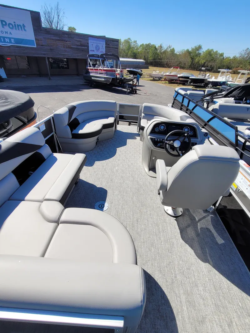 Slide: The Image of 2025 Trifecta 22TRFCLE275 pontoon boat with spacious seating and modern helm. - 13