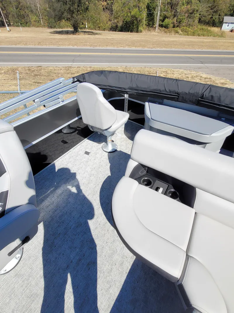 Slide: The Image of 2025 Trifecta 22TRFCLE275 boat interior with seating and cup holders. - 14