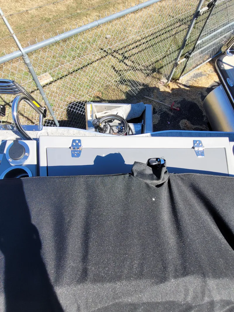 Slide: The Image of 2025 Trifecta 22TRFCLE275 boat with covered seating and storage area. - 15