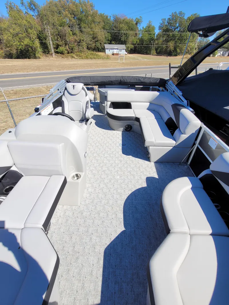 Slide: The Image of 2025 Trifecta 22TRFCLE275 pontoon boat with spacious seating and modern design. - 4