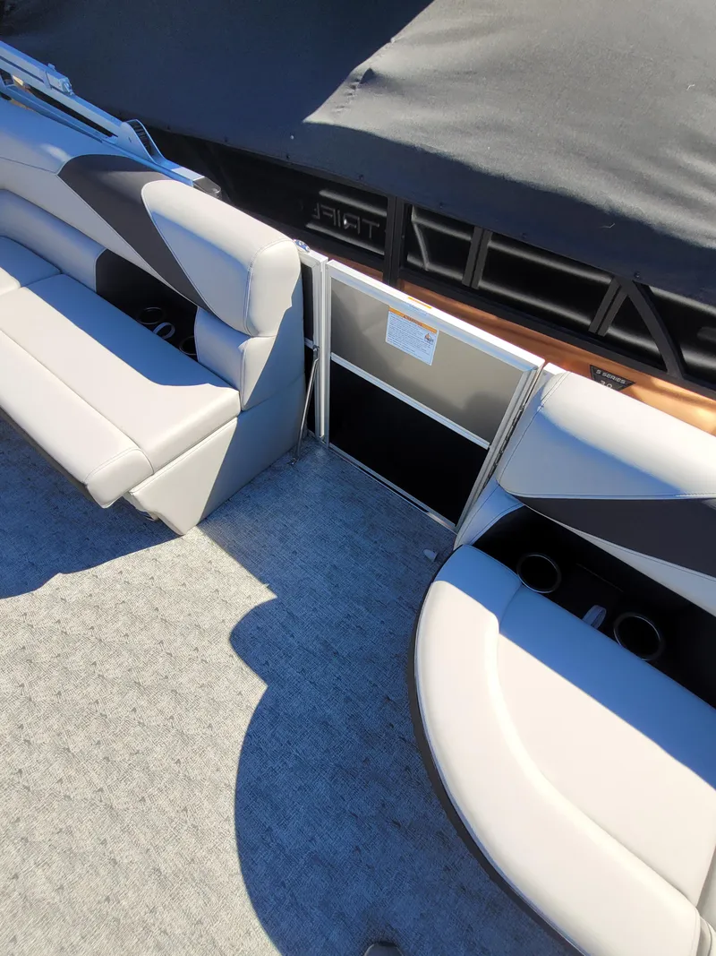 Slide: The Image of Interior of 2025 Trifecta 22TRFCLE275 pontoon boat with gray seating and carpet. - 7