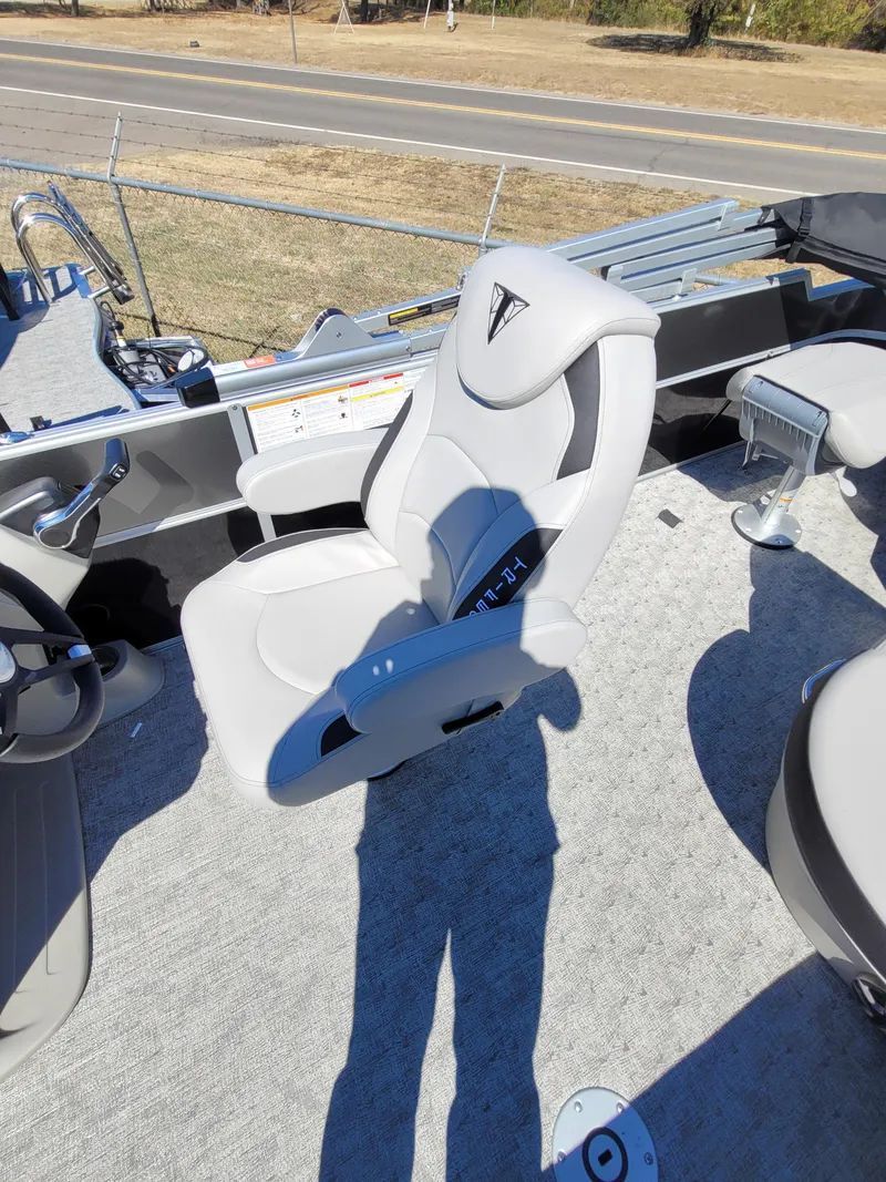Slide: The Image of 2025 Trifecta 22TRFCLE275 boat interior with modern captain's chair and steering console. - 9