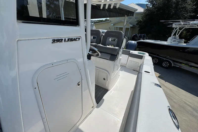 Slide: The Image of 2024 NauticStar 292 Legacy boat interior with seating and storage compartments. - 24