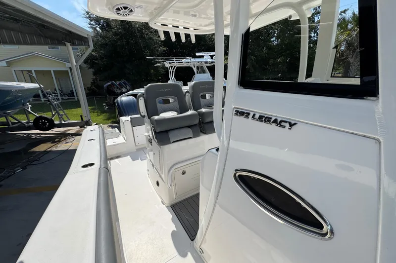 Slide: The Image of 2024 NauticStar 292 Legacy boat interior with seating and console details. - 25