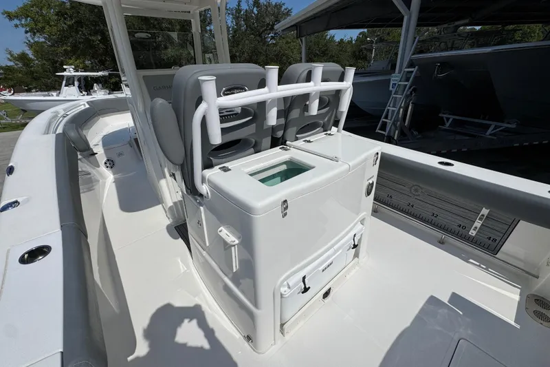 Slide: The Image of 2024 NauticStar 292 Legacy boat interior with seating and storage features. - 32