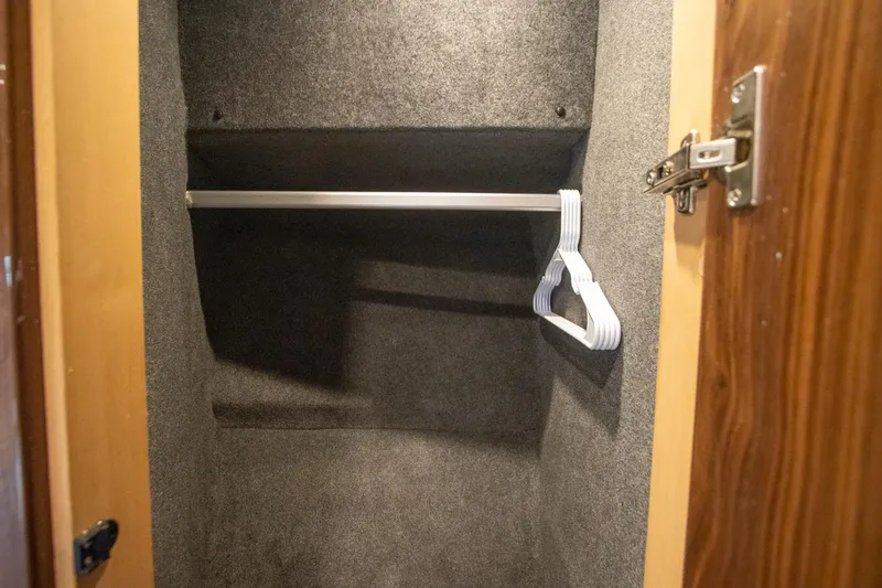 Slide: The Image of Empty closet with hangers in 2024 Riviera 4600 SY yacht. - 23