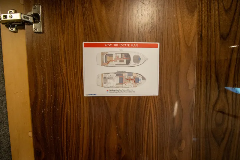 Slide: The Image of Fire escape plan on 2024 Riviera 4600 SY yacht door. - 24