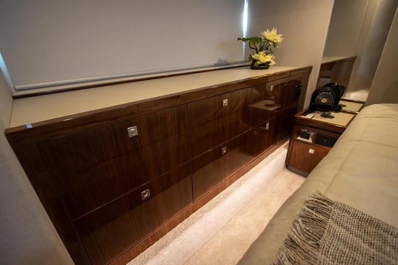 Slide: The Image of Luxurious interior of 2024 Riviera 4600 SY yacht with elegant wood cabinetry. - 35
