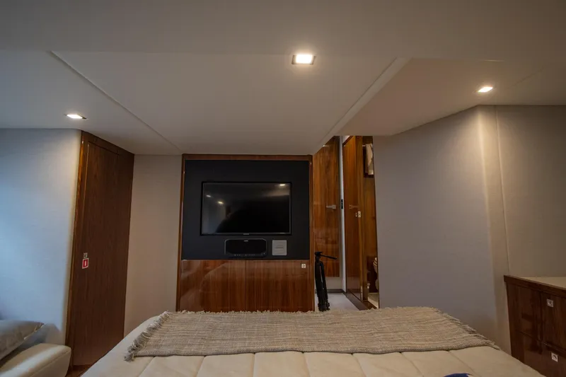 Slide: The Image of Luxurious interior of 2024 Riviera 4600 SY yacht with modern TV setup. - 38