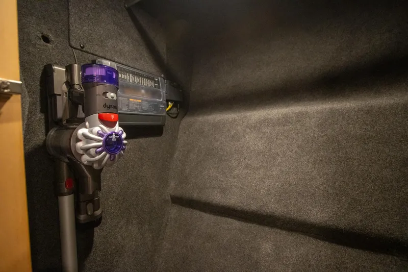 Slide: The Image of Dyson vacuum mounted in 2024 Riviera 4600 SY yacht interior. - 39