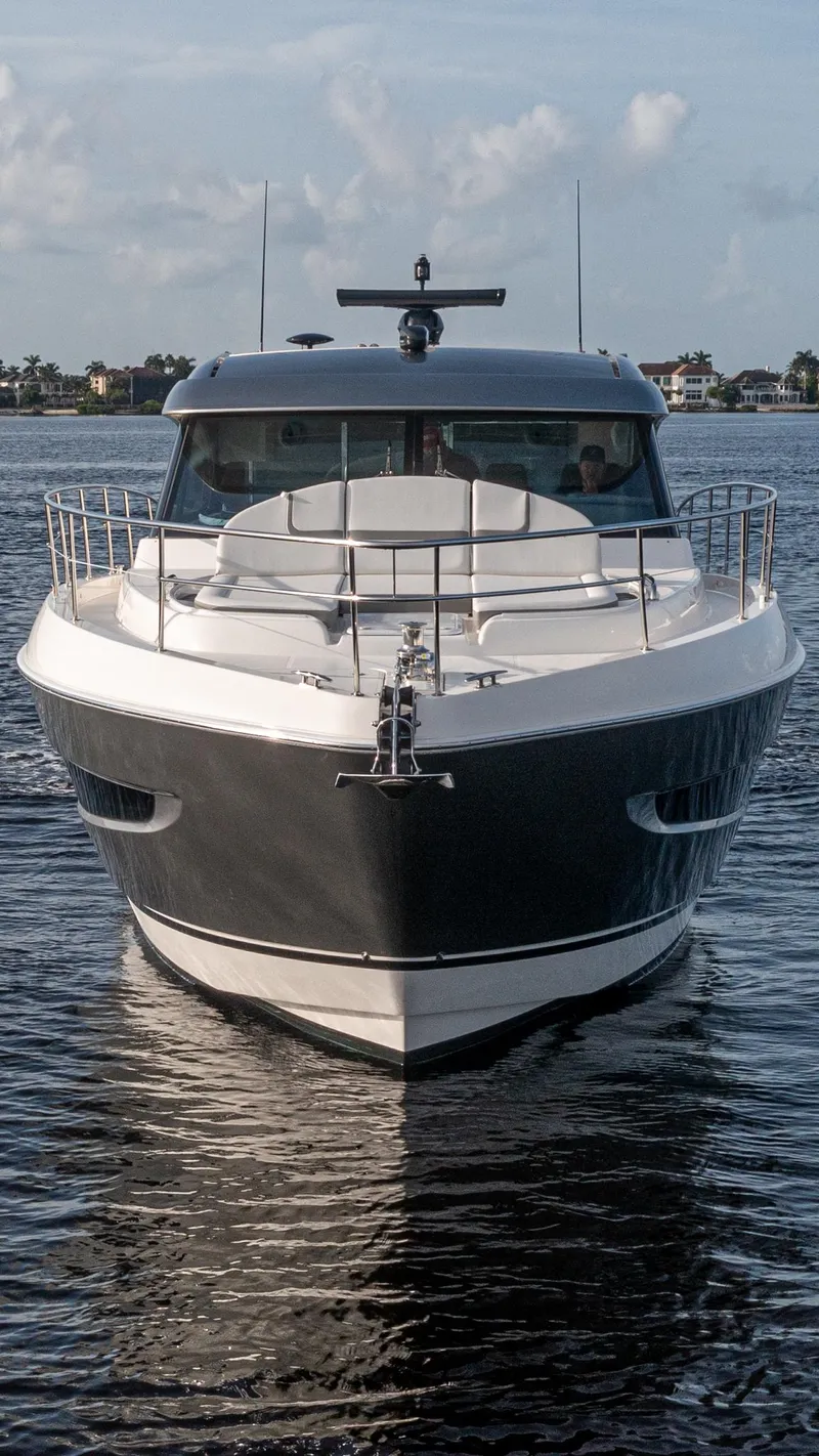 Slide: The Image of 2024 Riviera 4600 SY luxury yacht on calm water, front view. - 45