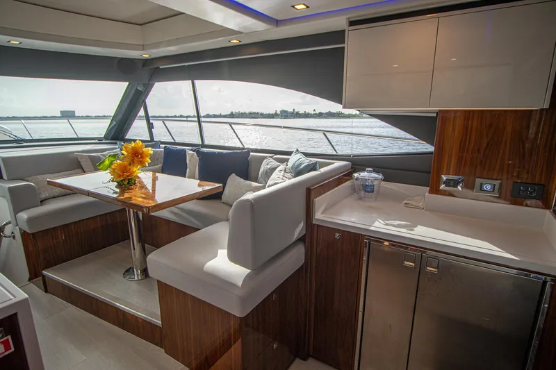 Slide: The Image of Luxurious interior of 2024 Riviera 4600 SY yacht with elegant seating and dining area. - 5