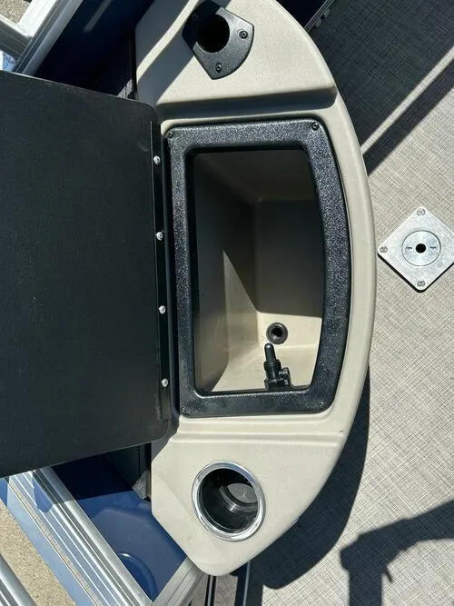 Slide: The Image of 2025 Sun Tracker Fishin' Barge 20 DLX boat storage compartment with cup holder. - 12
