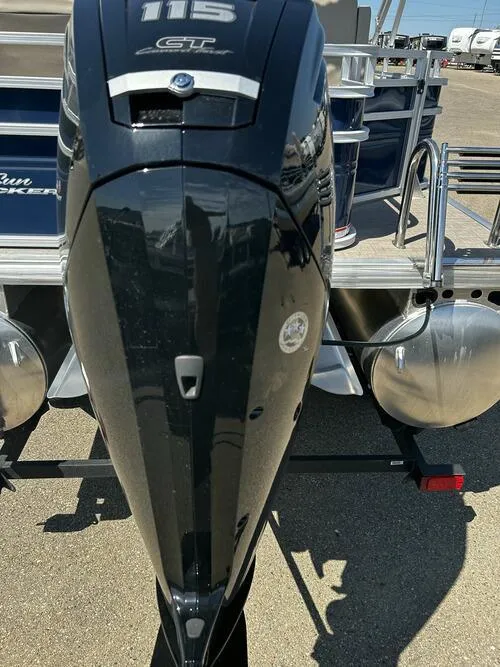 Slide: The Image of 2025 Sun Tracker Fishin' Barge 20 DLX with powerful outboard motor. - 13