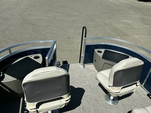 Slide: The Image of 2025 Sun Tracker Fishin' Barge 20 DLX interior with seating and fishing setup. - 7