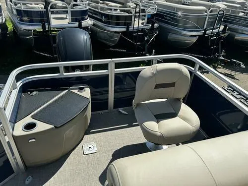 Slide: The Image of 2025 Sun Tracker Fishin' Barge 20 DLX interior with seating and fishing station. - 8