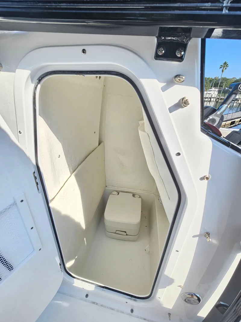 Slide: The Image of 2025 Sea Hunt Ultra 229 boat interior storage compartment. - 15