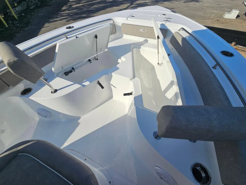 Slide: The Image of 2025 Sea Hunt Ultra 229 boat interior with seating and storage compartments. - 19