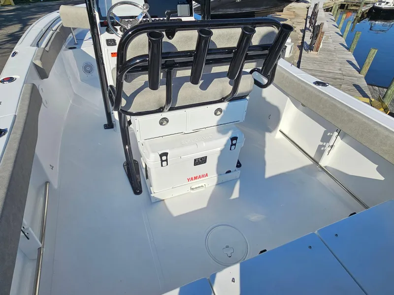 Slide: The Image of 2025 Sea Hunt Ultra 229 boat interior with Yamaha cooler and rod holders. - 23