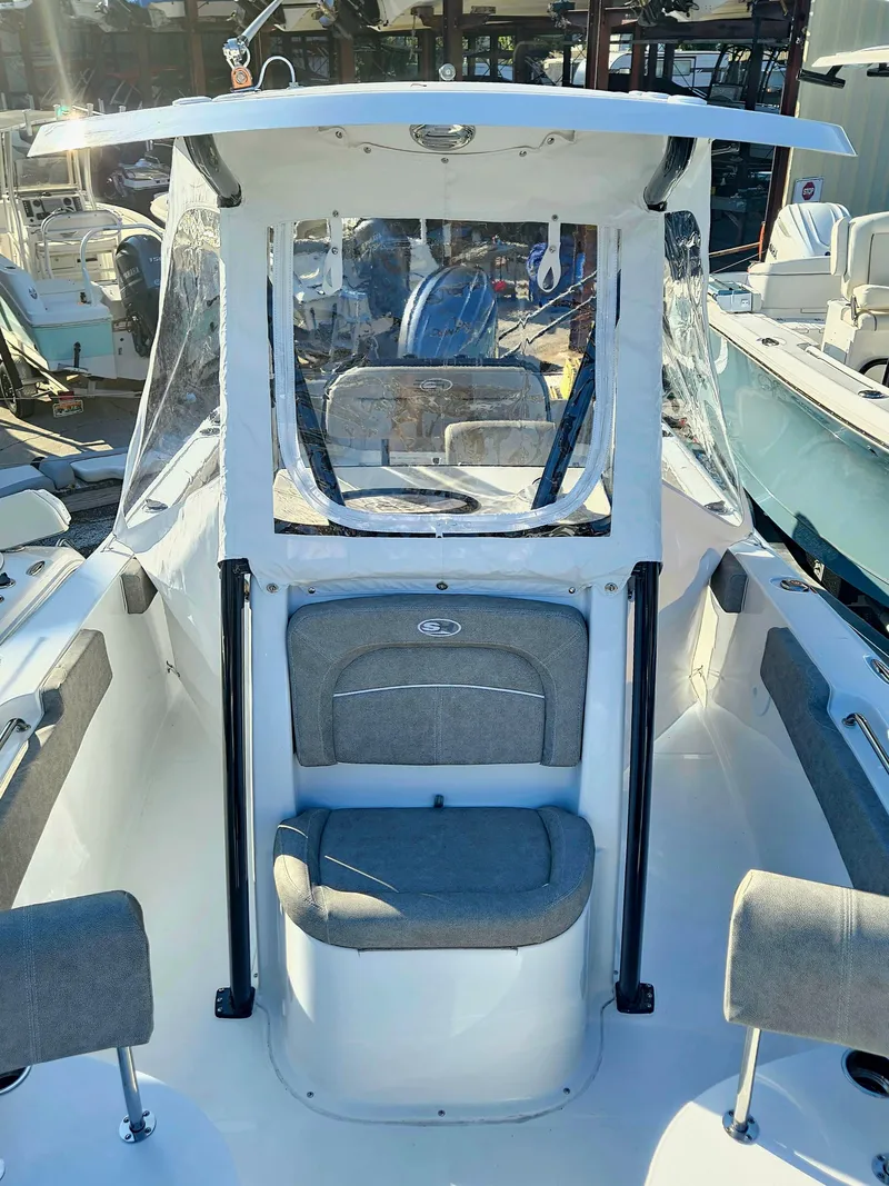 Slide: The Image of 2025 Sea Hunt Ultra 229 boat interior with seating and console. - 25