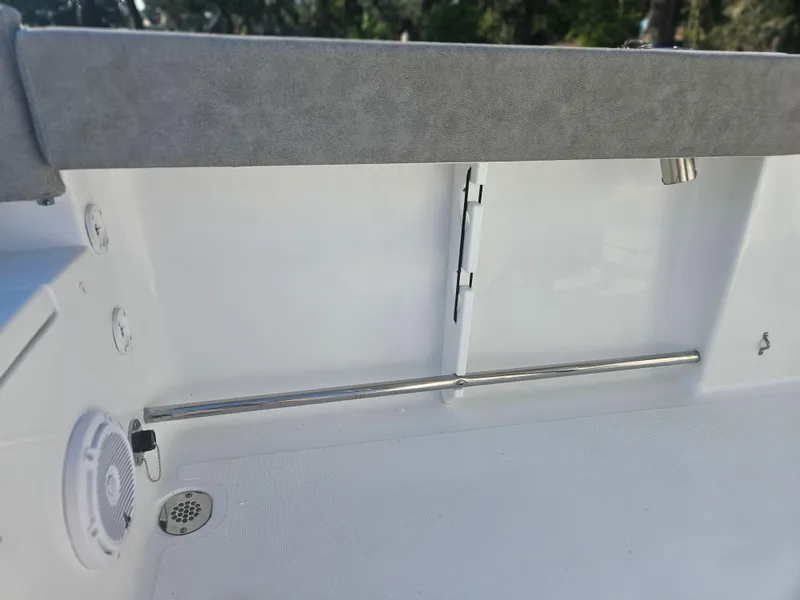 Slide: The Image of 2025 Sea Hunt Ultra 229 boat interior detail with speaker and railing. - 26