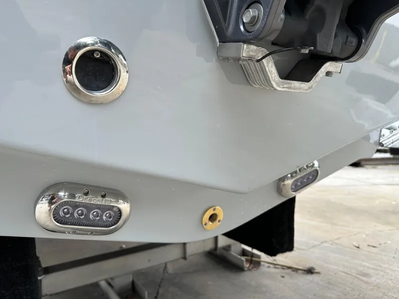 Slide: The Image of 2025 Sea Hunt Ultra 229 boat stern with underwater lights and fittings. - 27