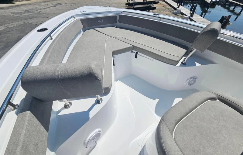 Slide: The Image of 2025 Sea Hunt Ultra 229 boat interior with gray cushioned seating. - 3