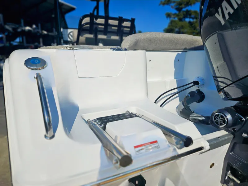 Slide: The Image of 2025 Sea Hunt Ultra 229 boat with Yamaha engine and swim ladder. - 6