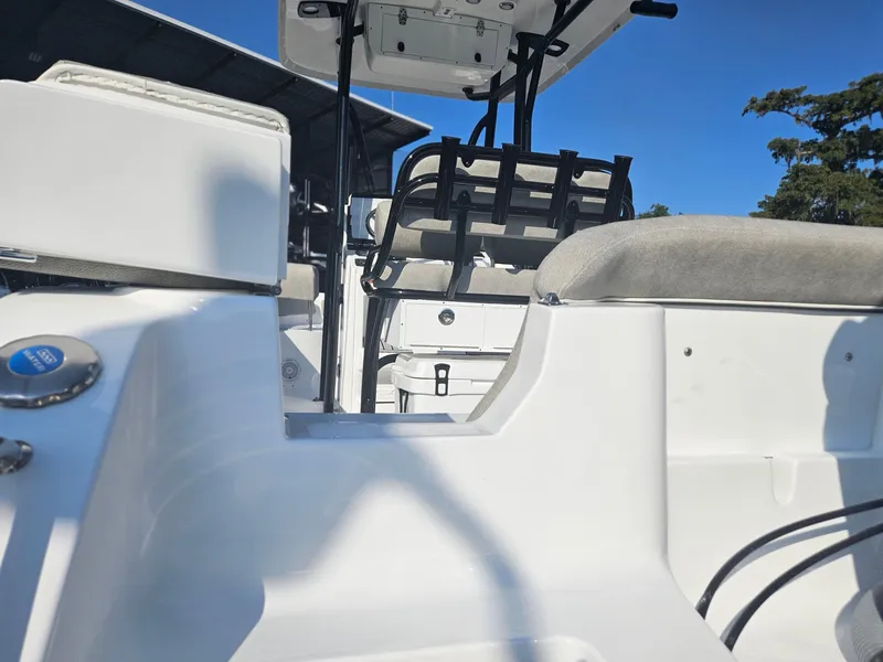 Slide: The Image of 2025 Sea Hunt Ultra 229 boat interior with seating and console. - 7